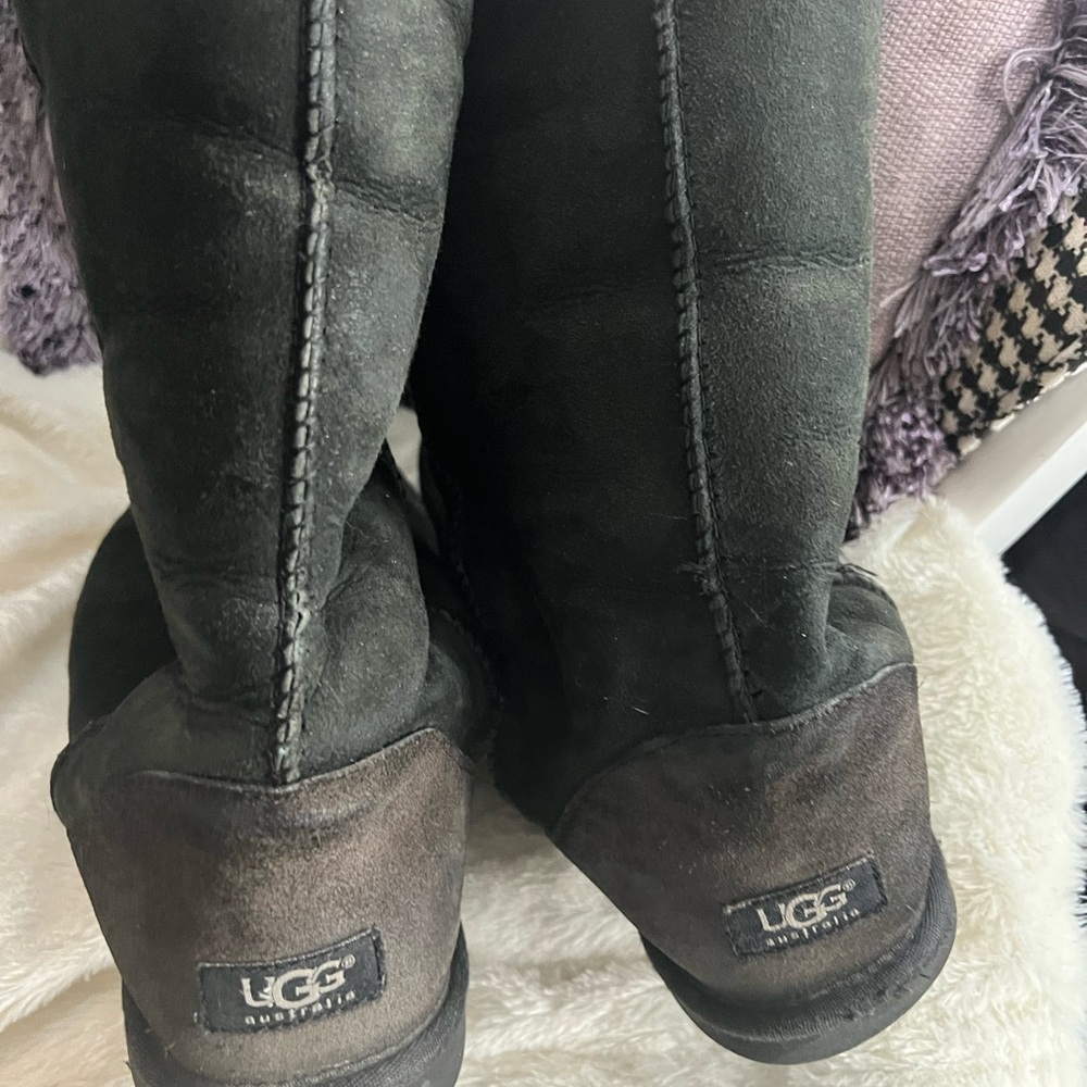 Well loved Uggs black size 11 great for around town or ranch
